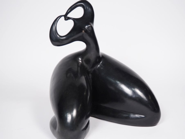 TOUTAIN.  "jeune femme assise" Sculpture en bronze à patine noire H. 4