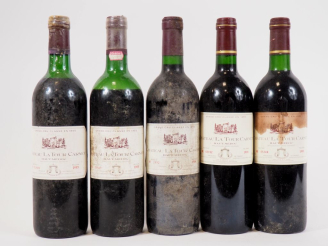 Vente aux enchères 5 BOUTEILLES CHÂTEAU LA TOUR CARNET : 2 de 1985 HEP - 1 de 1985 VIDANG