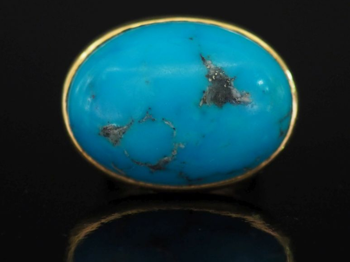 Importante bague en or jaune 750, sertie en son centre de turquoise en