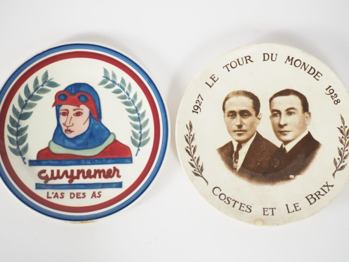 Ensemble de 2 assiettes commémoratives en Gien et Sarreguemines.  "Guy