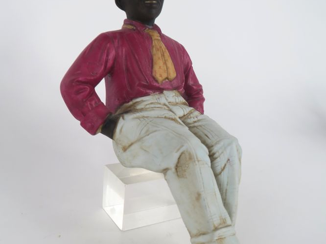 Sujet 1900 en biscuit polychrome, "jeune homme les mains dans les poch