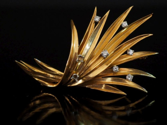 Vente aux enchères Broche en or jaune 750 en forme de branchage stylisé et agrémentée de 