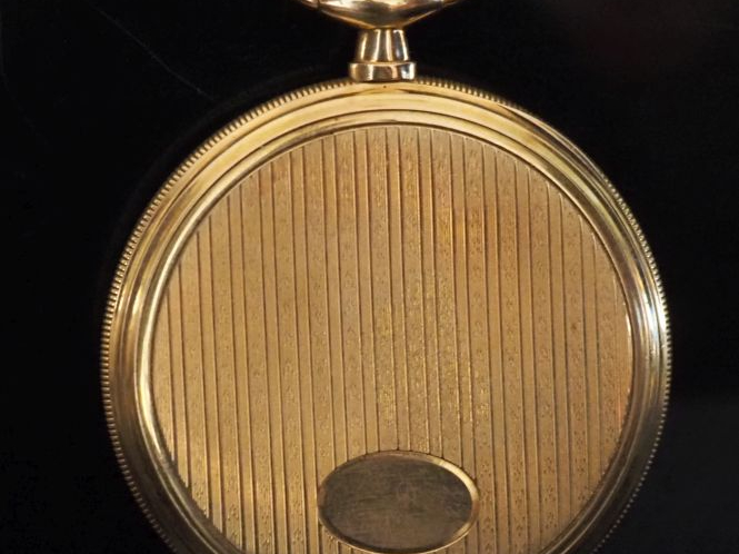 UNIC Montre de gousset en or jaune 750.  Cadran à chiffres arabes.  Co