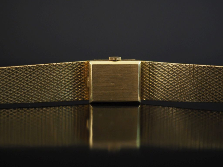 Montre bracelet de dame de style Art déco, boitier et bracelet en or j