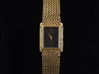 Vente aux enchères OMEGA,  Montre bracelet de dame, boitier et bracelet en or jaune 750. 