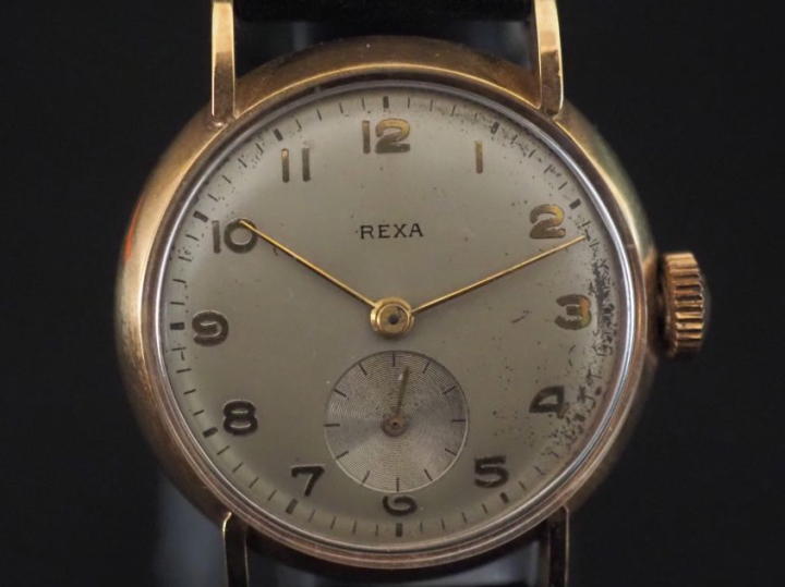 REXA Montre bracelet boitier en plaqué or.  Cadran rond à chiffres ara