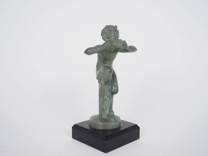 MIC. "Pan". Sujet en régule en patine verte. H. (avec le socle) 19 cm.