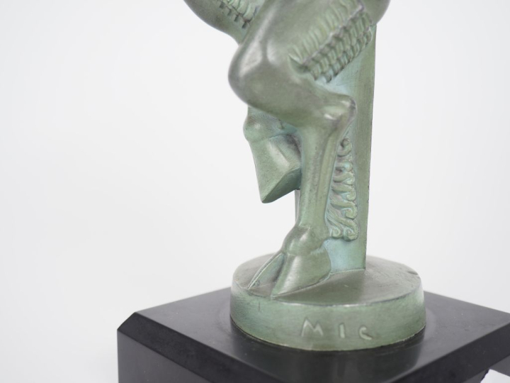 MIC. "Pan". Sujet en régule en patine verte. H. (avec le socle) 19 cm.