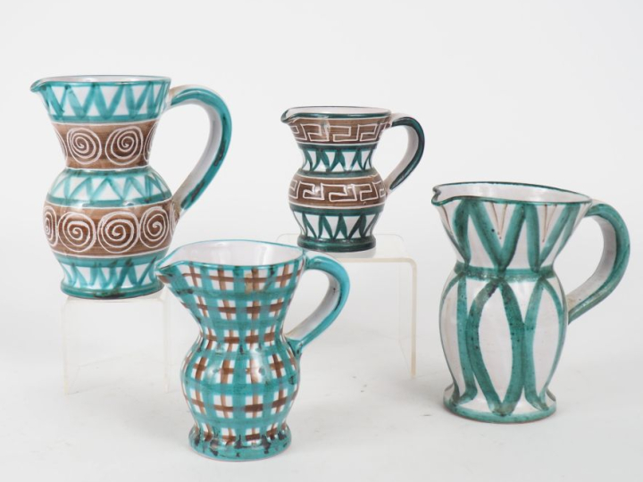 Robert PICAULT. Quatre differentes verseuses en céramique polychrome. 