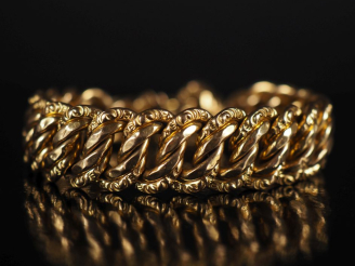 Vente aux enchères Gourmette en or 750, chainette de sécurité Poids : 29 g   