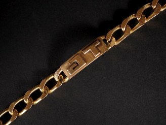 Vente aux enchères Bracelet gourmette en or jaune 750, monogrammé J. T.  Poids : 88 g   