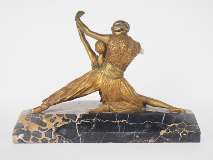 Claire COLINET.  "la danse"  Groupe en bronze patiné et doré sur un so