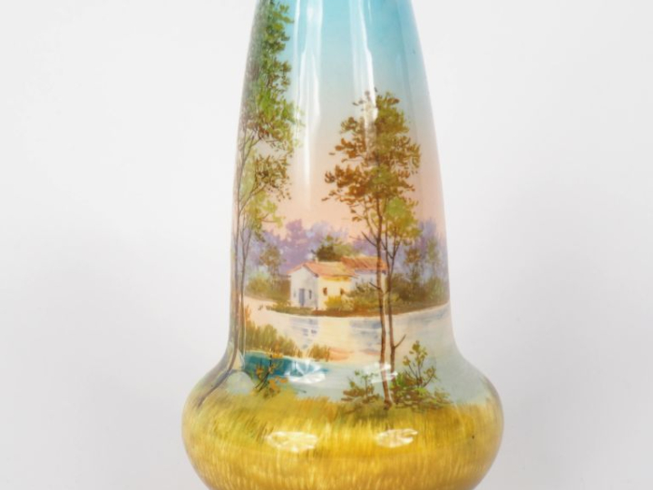 J. MASSIER.  Vase en céramique polychrome à décor de paysage lacustre.