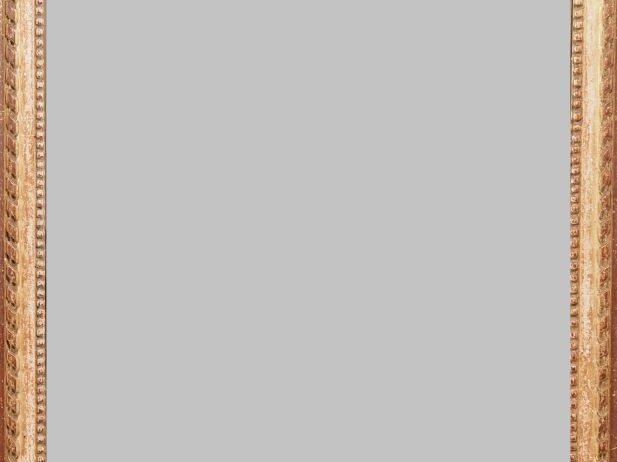 Miroir fin XIXème - début XXème de style Louis XVI en bois et stuc dor