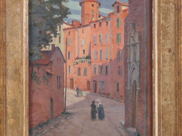 LIOZU.  "Village du midi animé" Huile sur panneau, signée en bas à gau