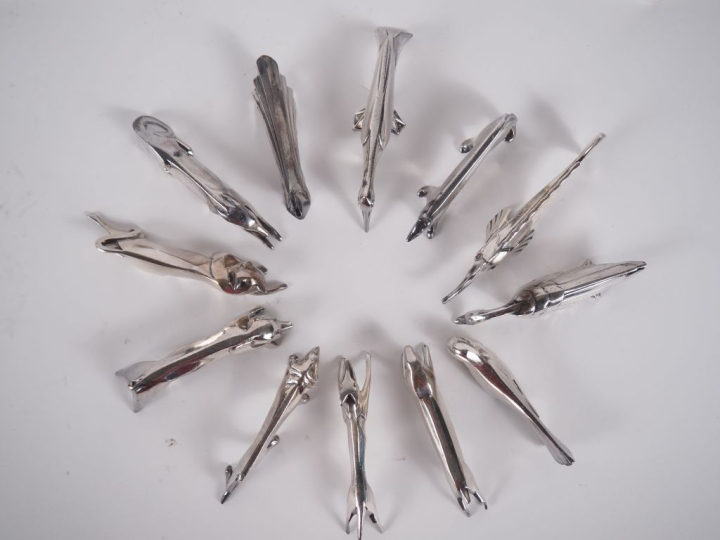 GALLIA. Suite de 12 porte-couteaux en métal argenté à décor zoomorphe,