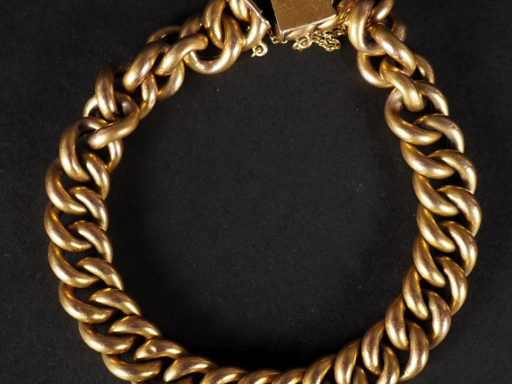 Bracelet souple en or jaune 750, maille gourmette. Chainette de sécuri