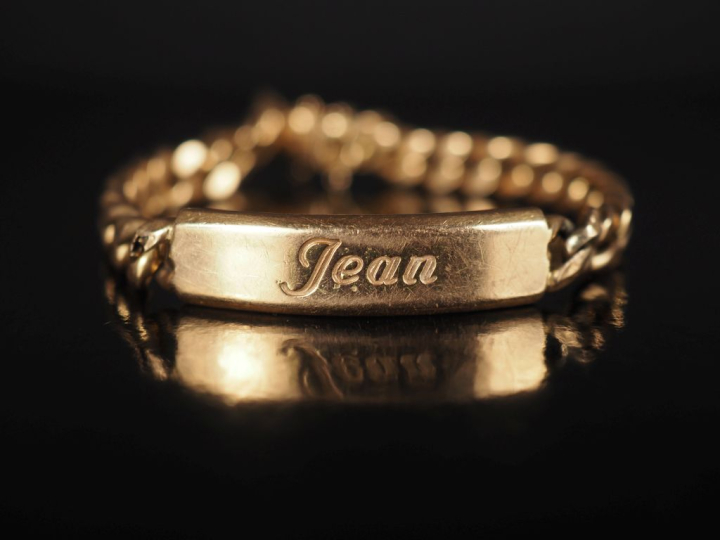 Bracelet gourmette en or jaune 750, marquée "Jean". Long. 21 cm Poids.
