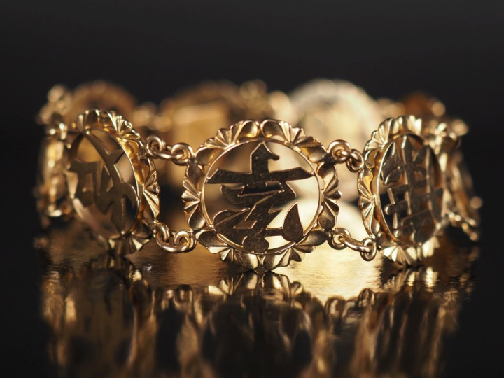 Bracelet souple en or jaune 585, composé de maillons ronds ajourés, à 