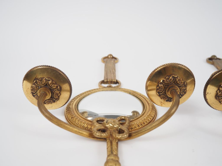 PETITOT. Suite de trois appliques doubles de style Louis XVI en bronze