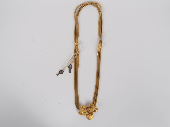 Ceinture fantaisie en métal doré à maille souple à décor de mufles de 