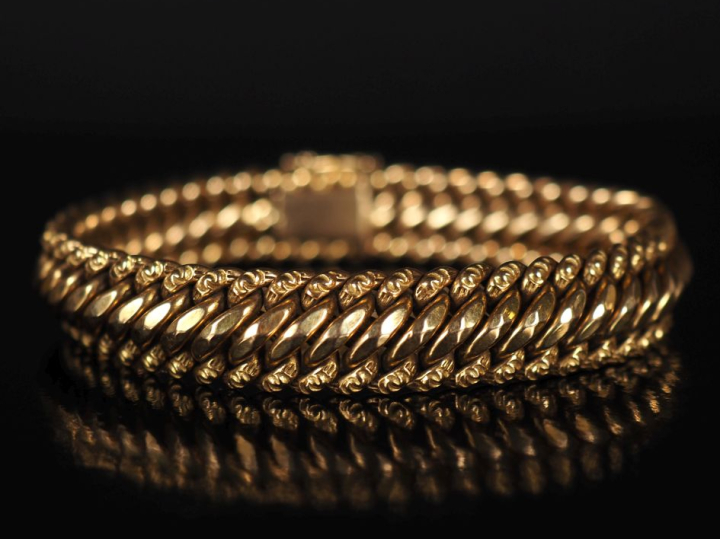 Bracelet souple en or jaune 750, maille américaine.  Larg. 1,1 cm Long
