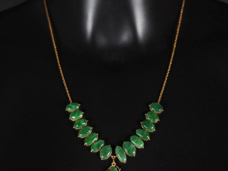 Vente aux enchères Collier souple en or jaune 375, maille forçat, orné en son centre de c
