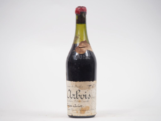 Vente aux enchères 1 BOUTEILLE ARBOIS ROUGE "CAVEAU DE BACCHUS" LUCIEN AVIET - 1990 - ET 