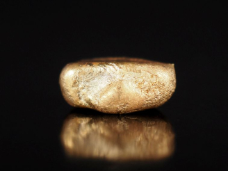 Vente aux enchères Petite pépite en or jaune 750. Poids. 1,52 g