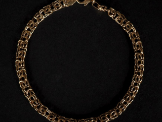 Vente aux enchères Bracelet souple en or jaune 750, maille entrelacée et ajourée.  Long. 