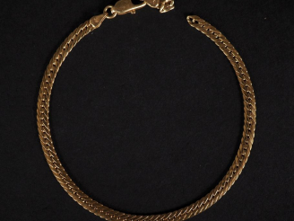 Vente aux enchères Bracelet souple en or jaune 750, maille plate gourmette.  Long. 19 cm 