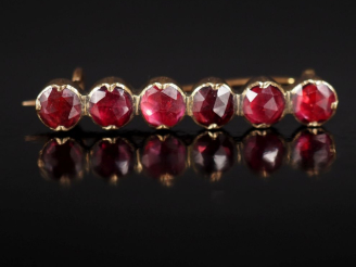 Vente aux enchères Broche barrette en or jaune 750 et argent doré, sertie d'une ligne de 