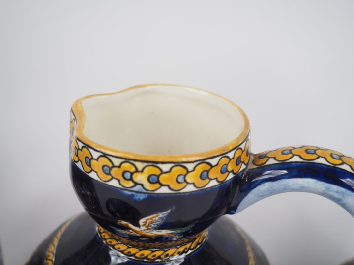 GIEN.  4 différentes verseuses en faience, décor de style Renaissance 