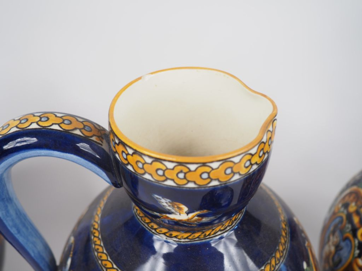 GIEN.  4 différentes verseuses en faience, décor de style Renaissance 