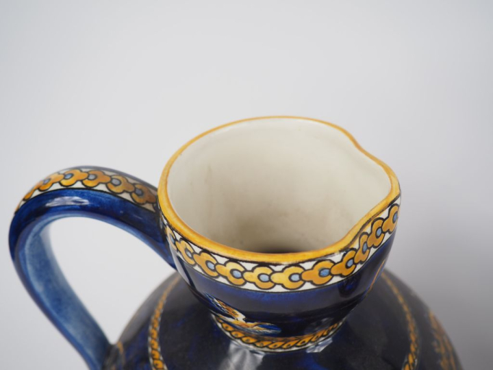 GIEN.  4 différentes verseuses en faience, décor de style Renaissance 