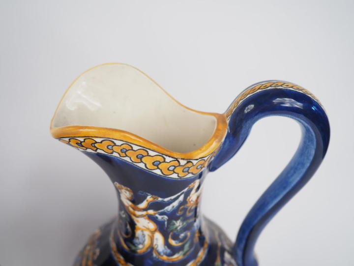 GIEN.  4 différentes verseuses en faience, décor de style Renaissance 